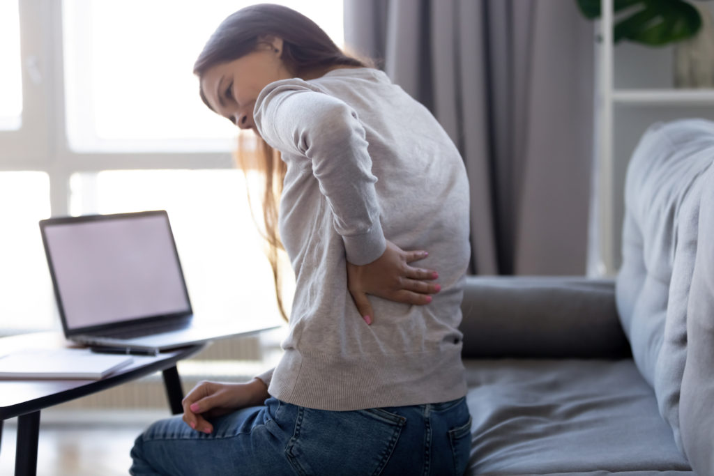 woman touch her back pain