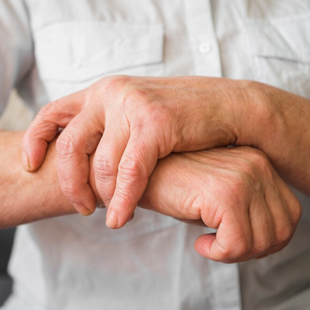 woman holding her wrist due to carpal tunnel pain