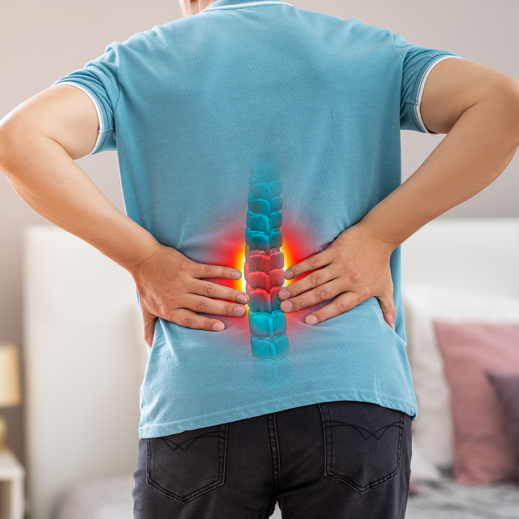 Man holding lower back in pain with highlighted spine illustration, chiropractor, hip pain