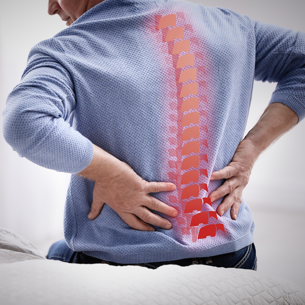 Man holding lower back with highlighted spine, chiropractor herniated disc pain
